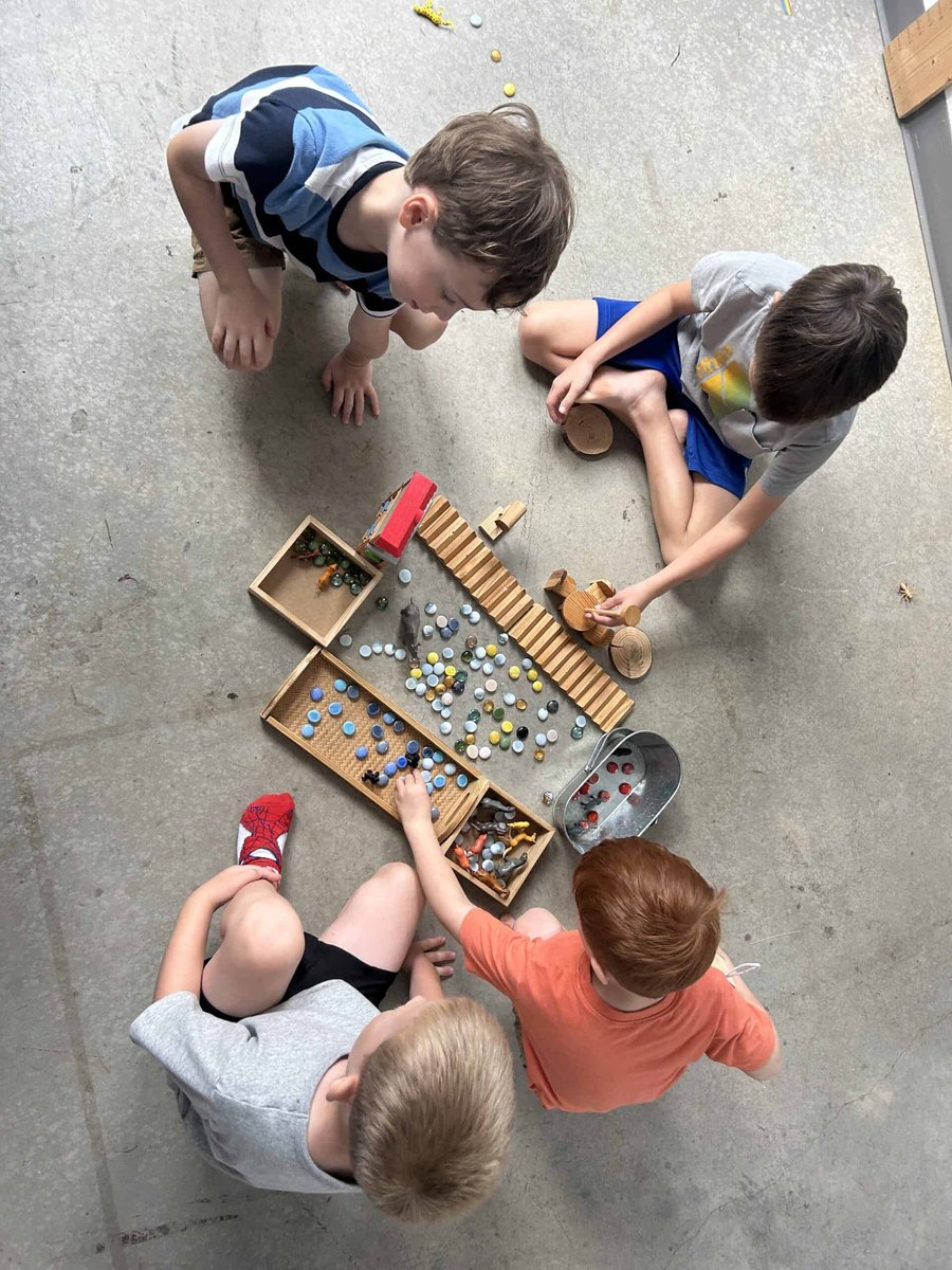 Selwyn students building a marble run together, seen from above
